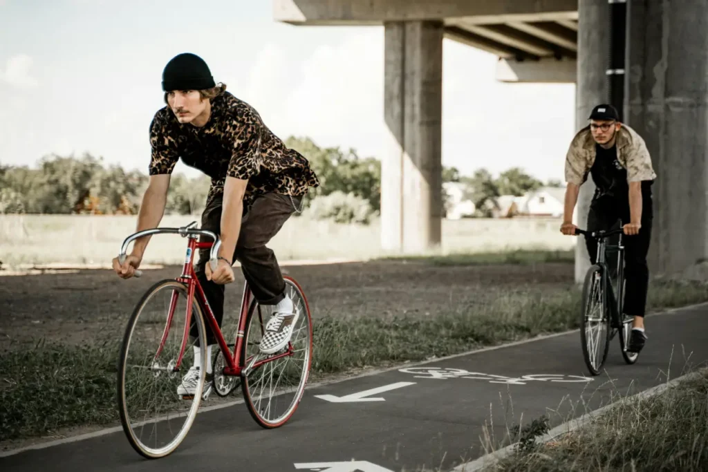 Men Riding Their Bicycles on a Bike Lane